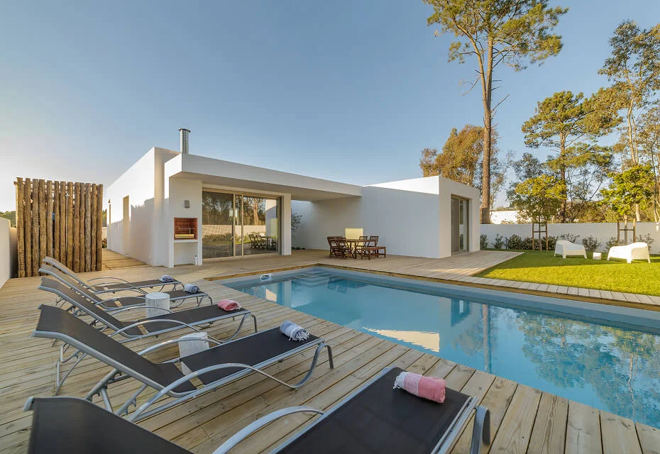 modern house with garden swimming pool and wooden deck