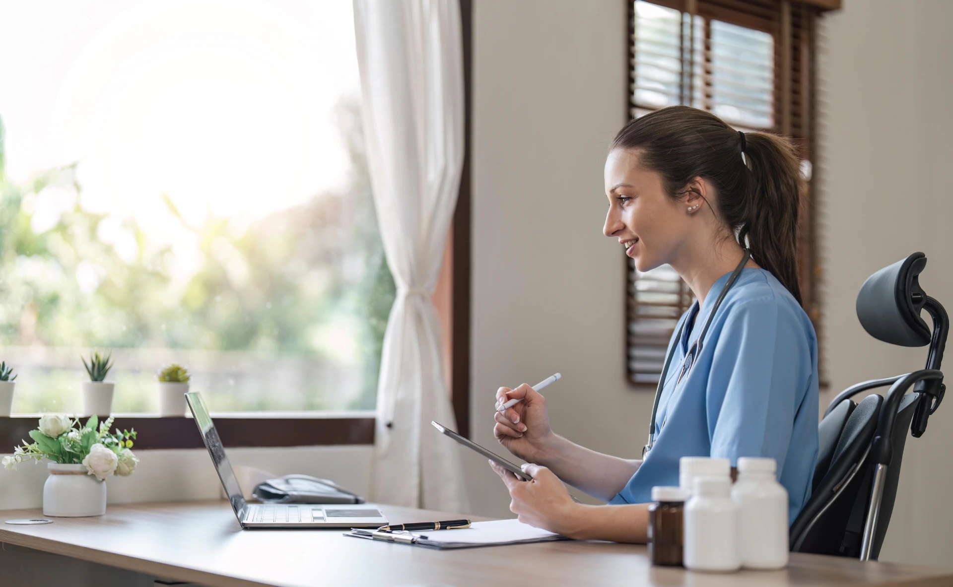 portrait of cheerful smiling young female doctor