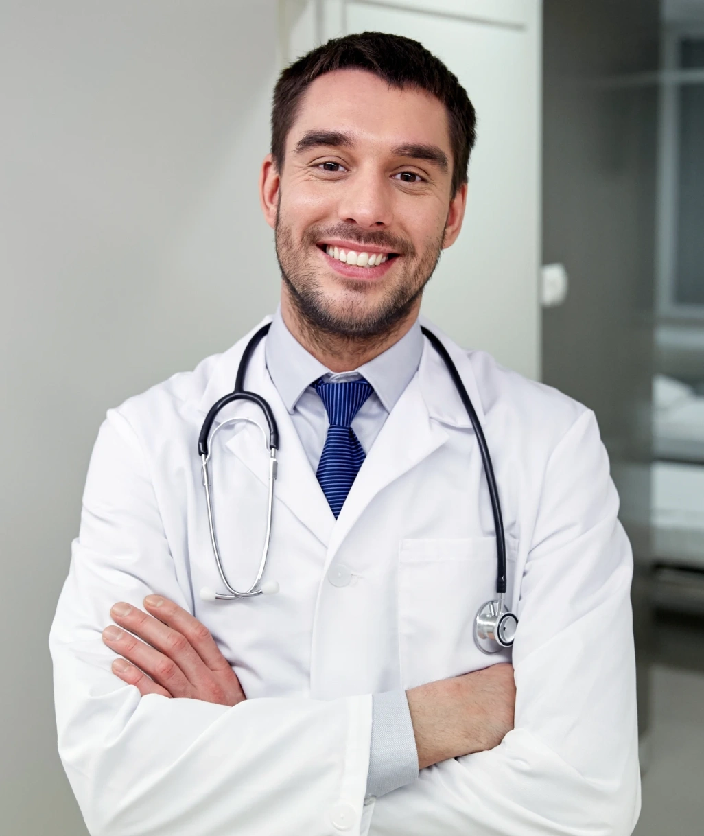 male doctor smiling on white coat