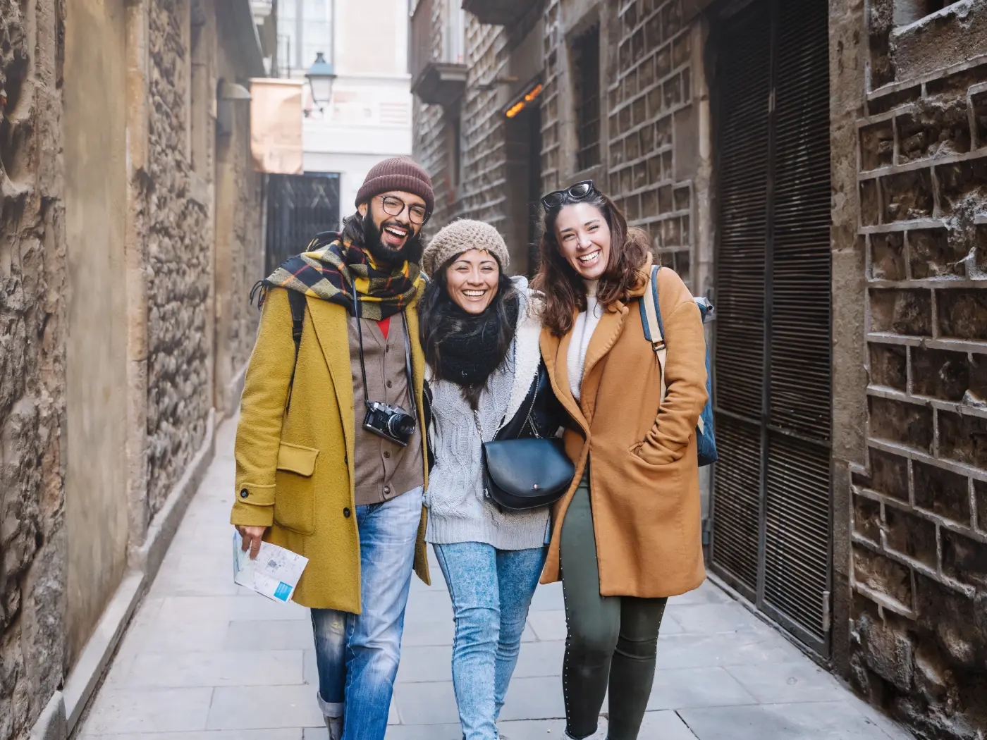 Tourist friends walking historical old town happy